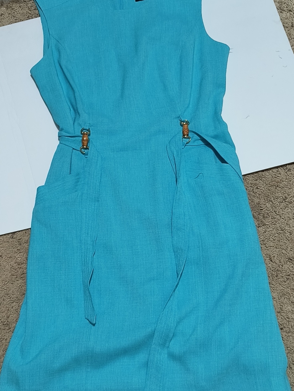Label on turquoise ribbed fabric